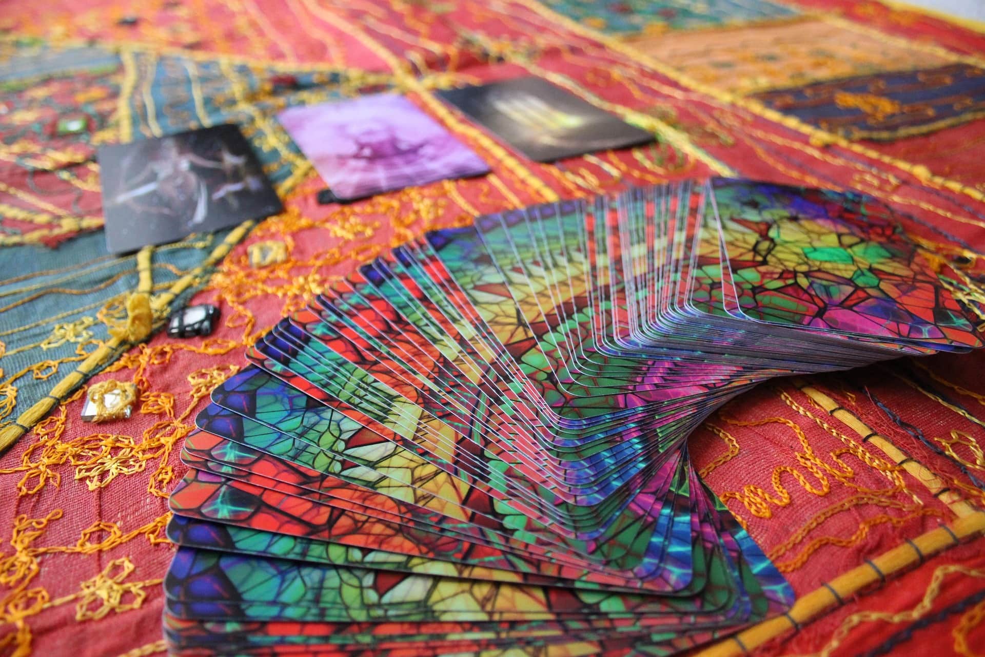 Metaphoric cards spread on a warm table
